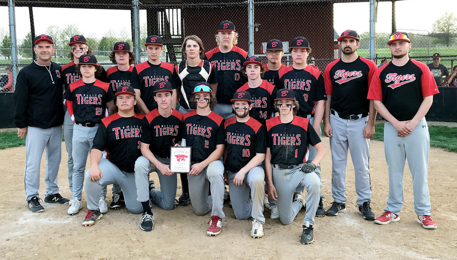 Belle Tiger baseball team members celebrate their 15-6 come-from-behind victory over Hermann’s Bearcats in the championship game of the Linn Baseball Tournament last Wednesday afternoon with a team photo at home plate in Osage County.